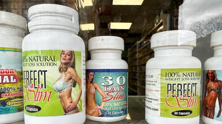 Capsules advertising weight loss properties are displayed at a store...