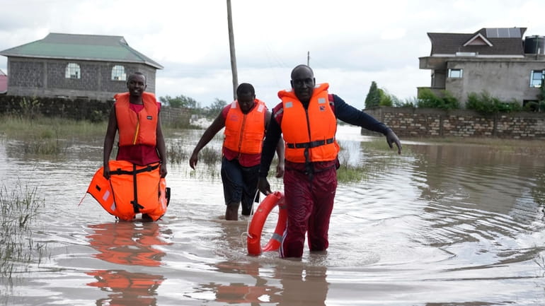 Kenyan Red Cross personnel and volunteers conduct search and rescue...