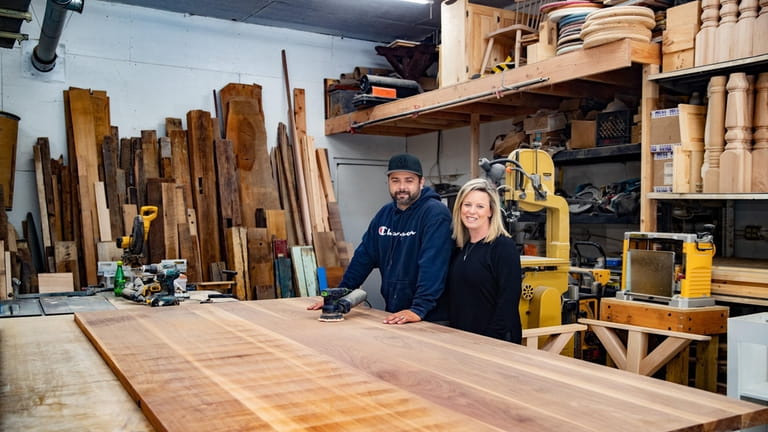 Co-owners Dan and Danielle De Melfi in the wood-working shop...