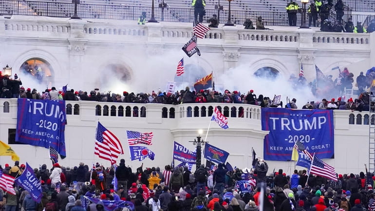 Rioters at the U.S. Capitol on Jan. 6, 2021, in...
