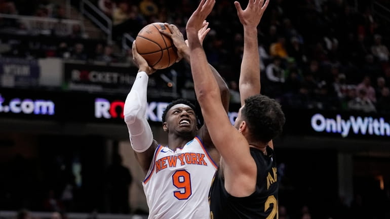 Knicks guard RJ Barrett (9) shoots as Cleveland Cavaliers forward...