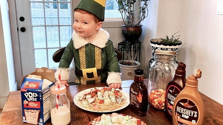 Toddler Colton Jenkins of Manorville as Buddy the Elf in...