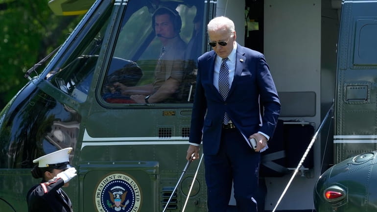 President Joe Biden steps off of Marine One on the...