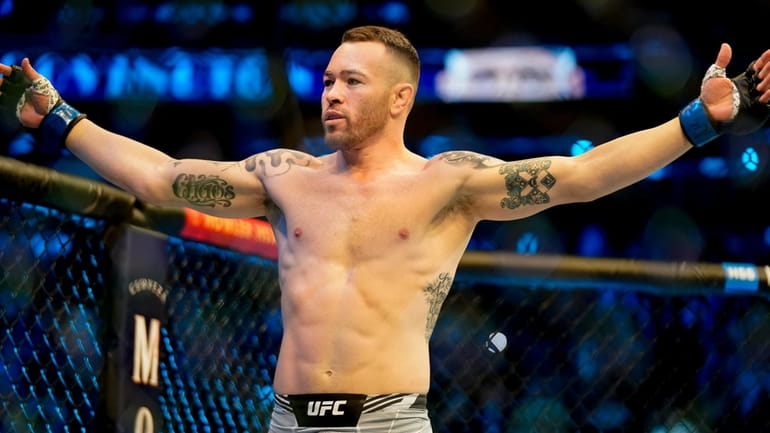 Fighter Colby Covington reacts before battling Kamaru Usman in a...