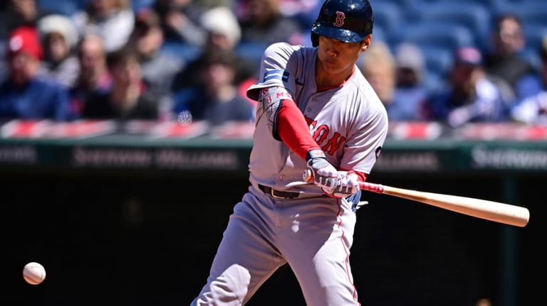 Boston Red Sox's Masataka Yoshida swings during the fifth inning...