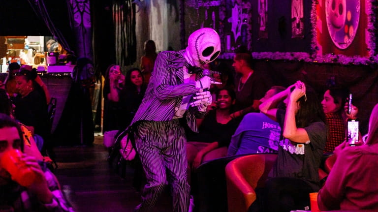Costumed performers entertain guest at Jack's Nightmare Halloween pop-up at...