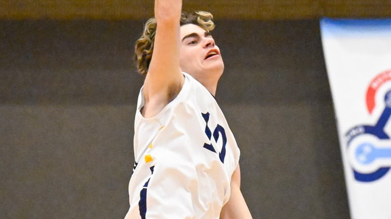Massapequa's Jack Schiffl spikes the ball during Division I pool play...