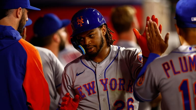 Khalil Lee #26 of the Mets celebrates a three-run home...