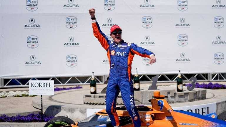 Chip Ganassi Racing driver Scott Dixon celebrates his victory during...