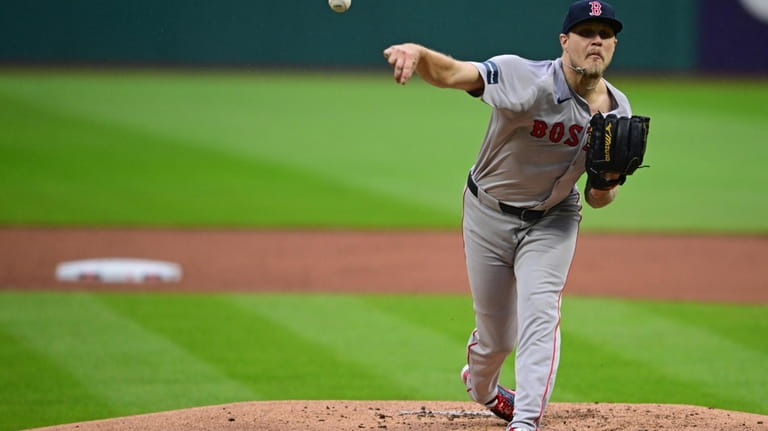 Boston Red Sox starting pitcher Tanner Houck delivers in the...