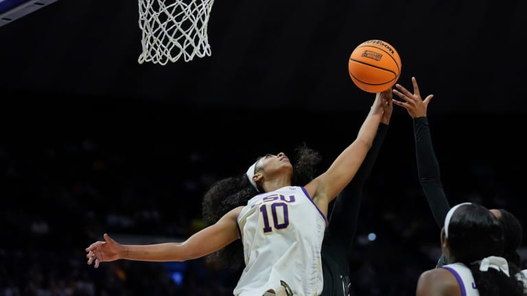 LSU forward Angel Reese (10) leaps for a rebound during...