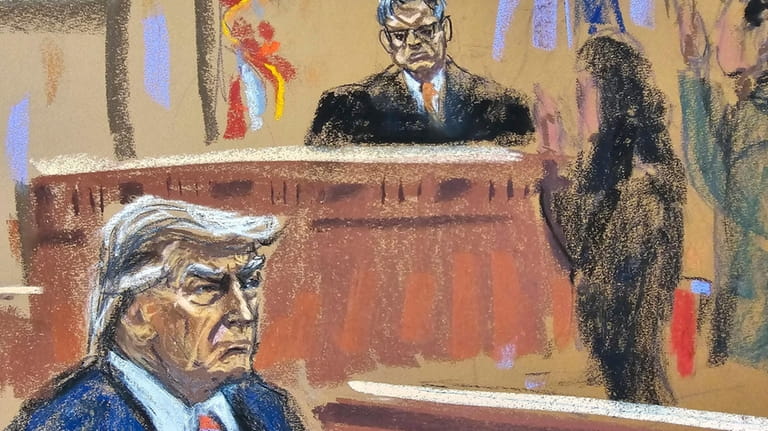 Former President Donald Trump sits as final jurors are sworn...