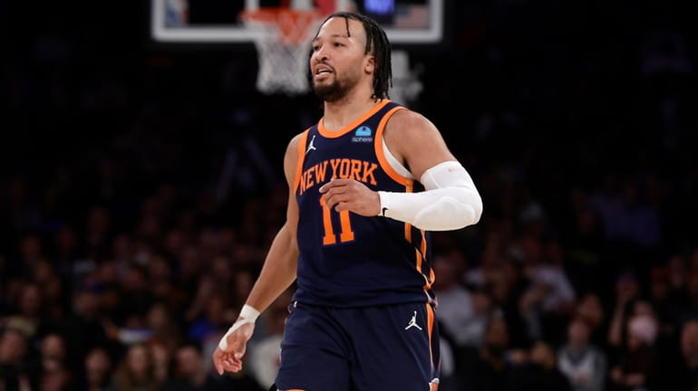 Jalen Brunson of the Knicks reacts after hitting a three-point shot...