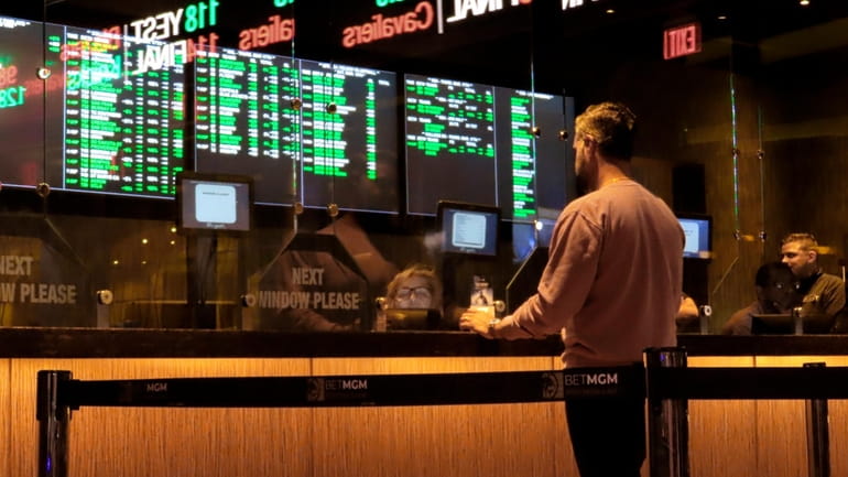 A customer makes a sports bet at the Borgata casino...