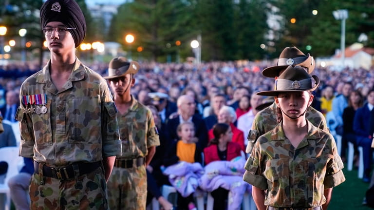 Military cadets react during an Anzac Day dawn service at...