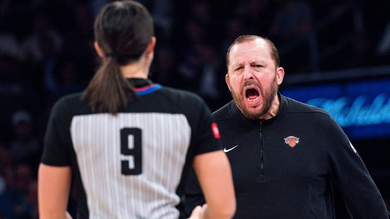 New York Knicks coach Tom Thibodeau, right, argues with a...