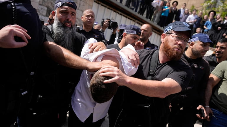 Israeli police detain a suspected attacker in an apparent car...