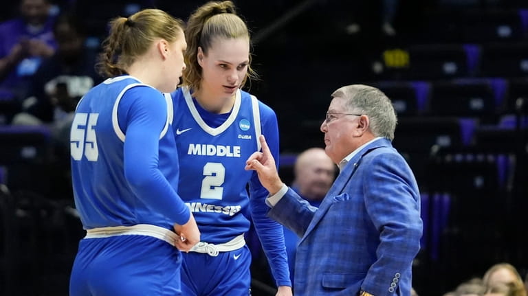 Middle Tennessee head coach Rick Insell talks to center Iullia...