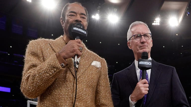 New York Knicks broadcasters Walt "Clyde" Frazier, left, and Mike...