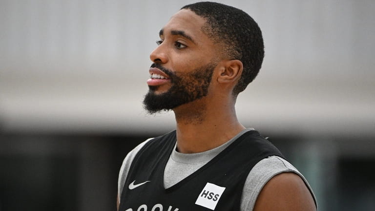 Nets forward Mikal Bridges looks on during training camp at...