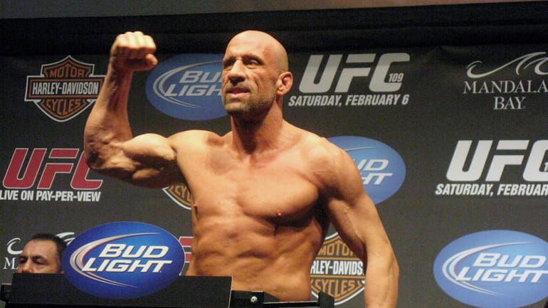 UFC Hall of Famer Mark Coleman gestures during the weigh-in...