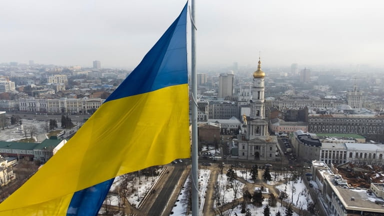 A Ukrainian national flag waves over the center of Kharkiv,...