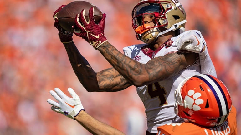 Florida State wide receiver Keon Coleman (4) catches a pass...
