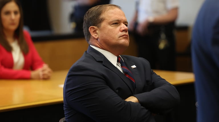 Suffolk County District Attorney Ray Tierney attends a court hearing...
