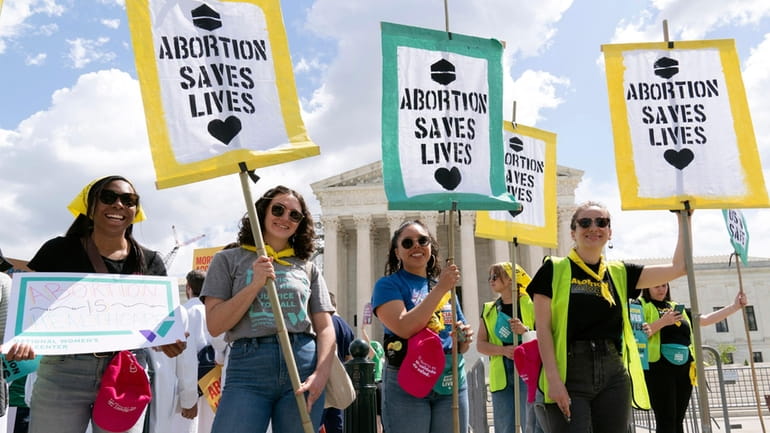 Abortion rights activists rally outside the Supreme Court, Wednesday, April...