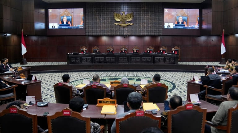 Judges preside over the election appeal hearing at the Constitutional...
