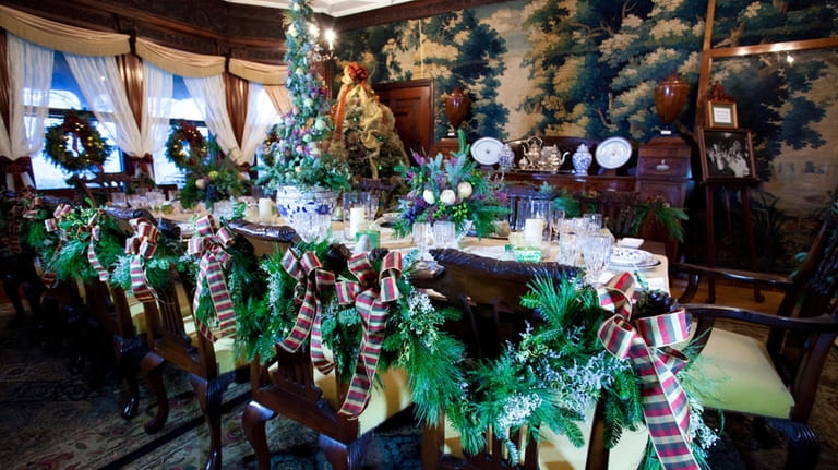 The formal dining room at Manor House is decorated for the...