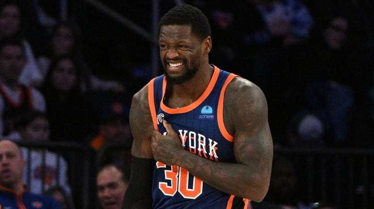 Knicks forward Julius Randle reacts after injuring his shoulder in...