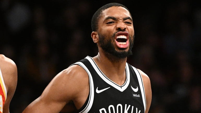 Nets forward Mikal Bridges yells to a teammate in the...