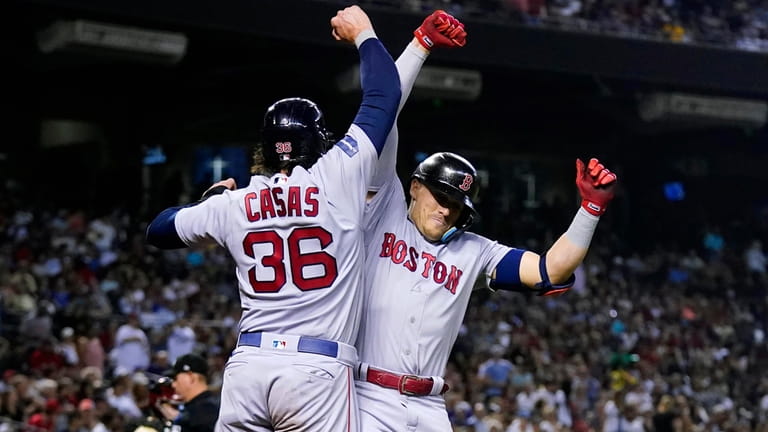 Boston Red Sox's Enrique Hernandez, right, celebrates his two-run home...