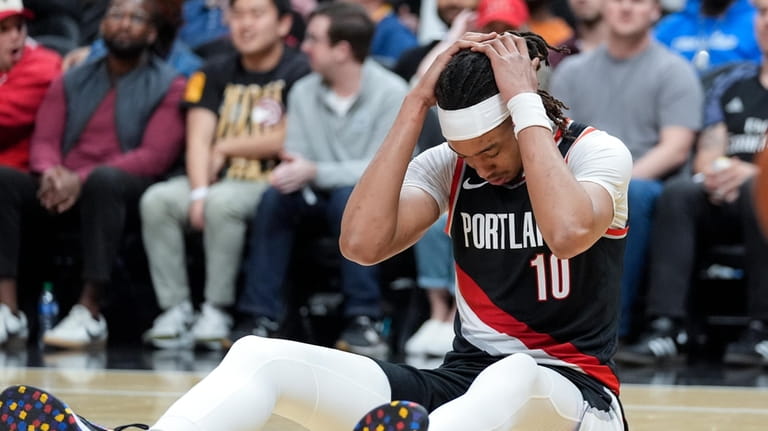 Portland Trail Blazers center Moses Brown (10) reacts after being...