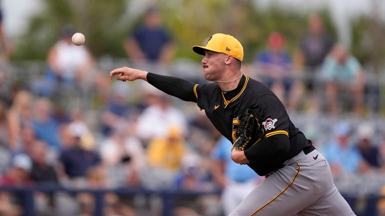 Pittsburgh Pirates pitcher Paul Skenes throws in the fourth inning...