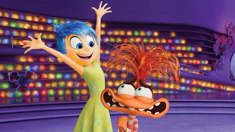 This image released by Disney/Pixar shows Joy, voiced by Amy...