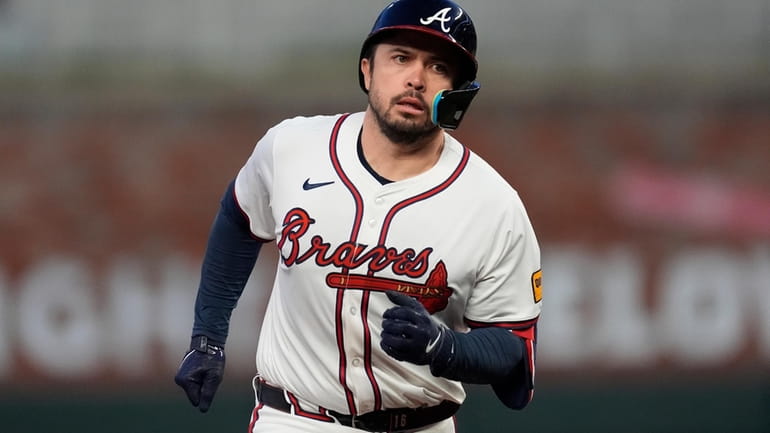 Atlanta Braves' Travis d'Arnaud runs the bases after hitting a...