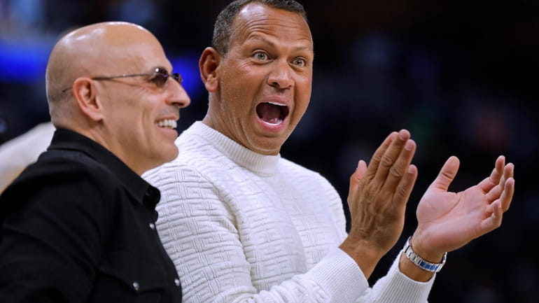 Minnesota Timberwolves and Lynx minority owners Marc Lore, left, and...