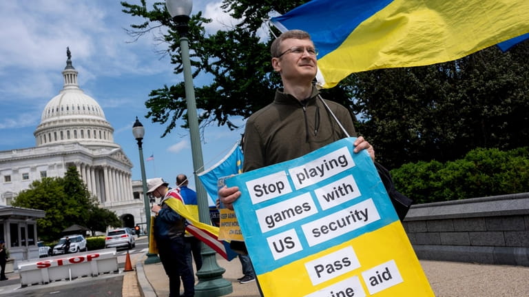 Activists supporting Ukraine, demonstrate outside the Capitol in Washington, April...