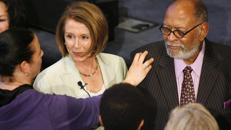 House Speaker Nancy Pelosi, center, and Reverend Cecil Williams, right,...