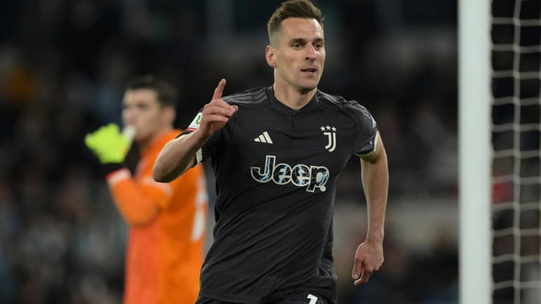 Juventus' Arkadiusz Milik celebrates after scoring his side's first goal...