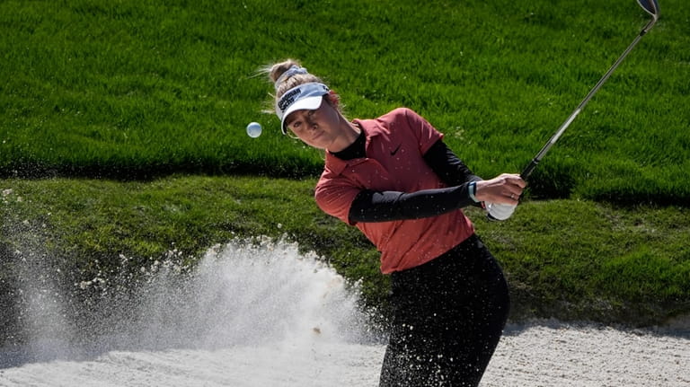 Nelly Korda hits out of a bunker at the fourth...