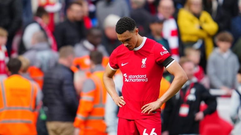 Liverpool's Trent Alexander-Arnold reacts disappointed after the English Premier League...