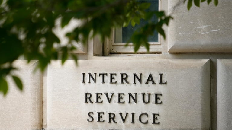 A sign outside the Internal Revenue Service building is seen,...