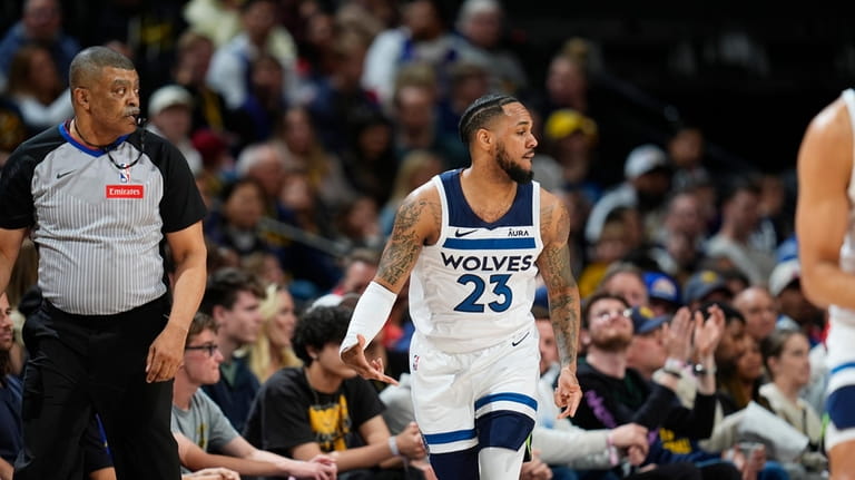 Minnesota Timberwolves guard Monte Morris grestures after hitting a 3-point...