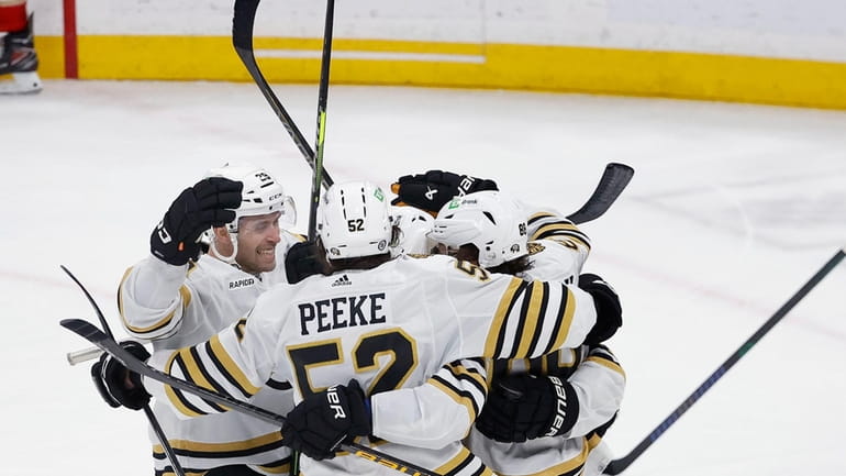The Boston Bruins celebrate their goal against the Florida Panthers...