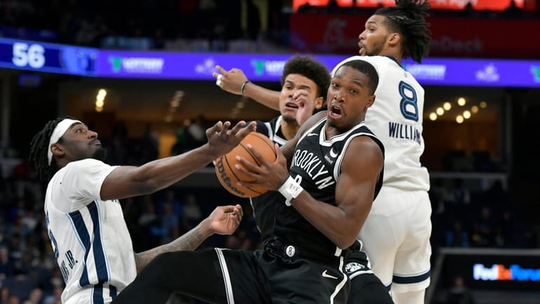 Brooklyn Nets guard Lonnie Walker IV, front right, controls the...