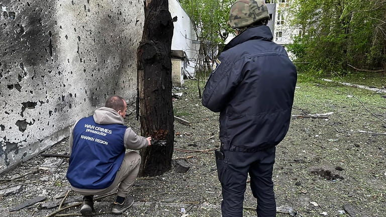 In this photo provided by Kharkiv Regional Prosecutor's Office, war...