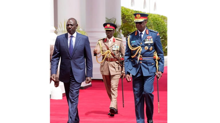 Kenya's military chief General Francis Ogolla, right, and Kenya's President...
